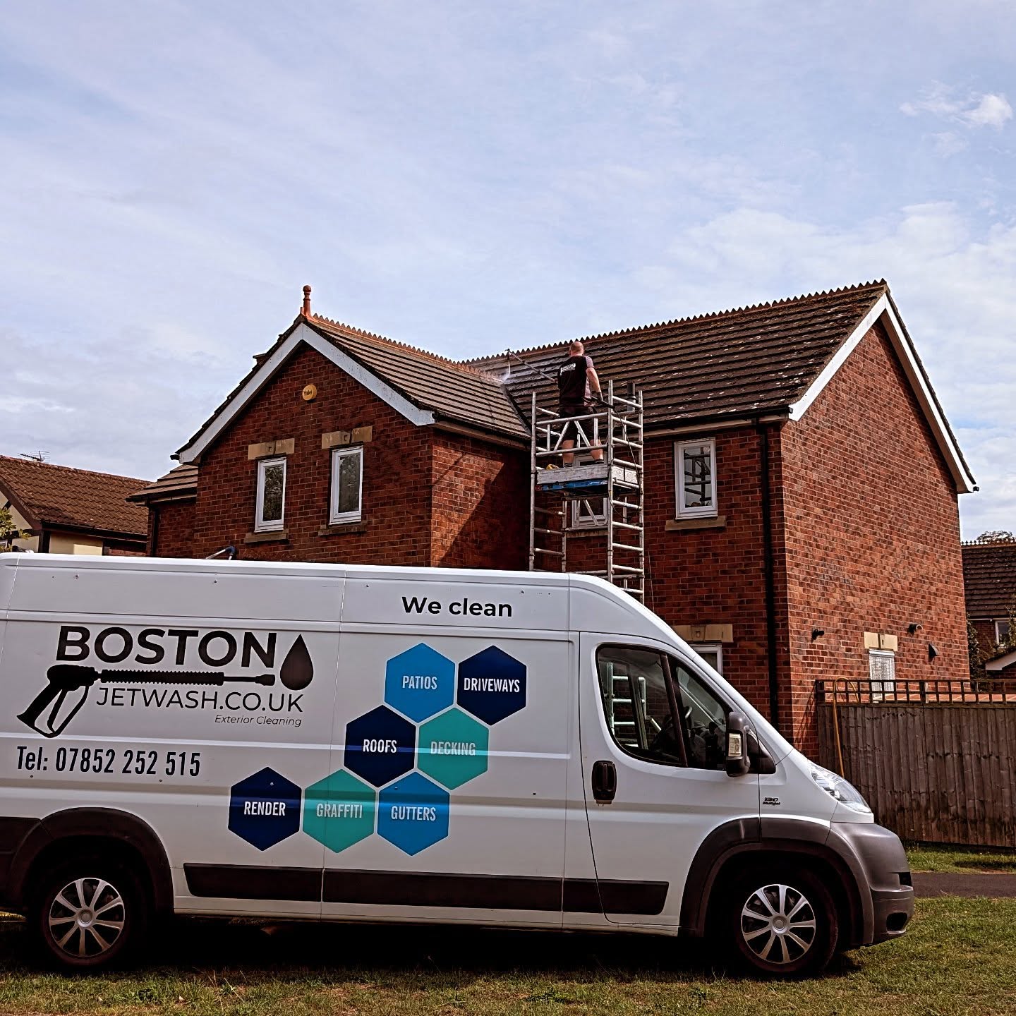 Pressure Washing Boston The Boston Jet Wash van parked in from of a house undergoing a roof clean.